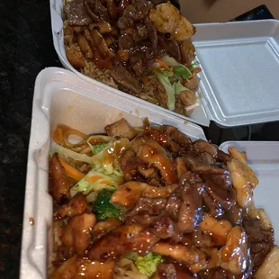 two take out containers of food