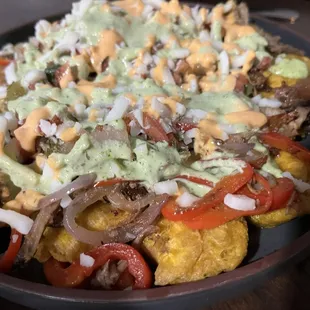 Plantain &apos;nachos&apos; with peril pork, avocado, pepper