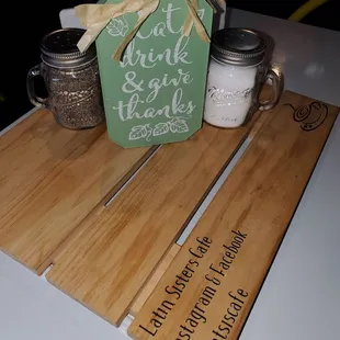 a wooden cutting board with a sign