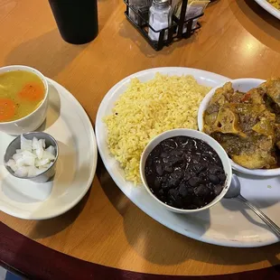 Oxtails, yellow rice, and black beans, and chicken noodle soup.