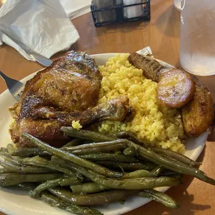 Baked chicken , yellow rice , green beans and sweet plantains