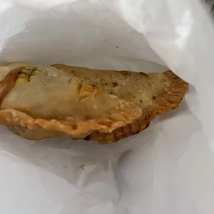 a pastry in a paper bag