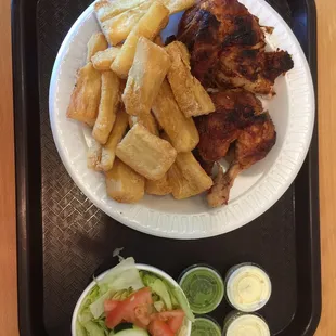 Half a chicken with yucca fries and salad.