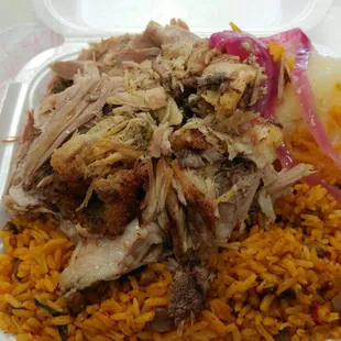 pernil (slow cooked pork shoulder) yuca and onions with seasoned rice and pigeon peas...sooo good!!!