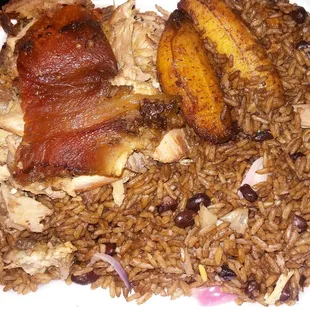 a plate of rice, beans, and meat
