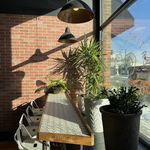 a table and chairs in front of a window