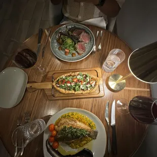 Mint crusted lamb, roasted apples and sweet fig flat bread, and the branzino paired with two glasses of the Fattoria di Rodano (Chianti)