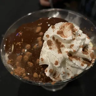 a dessert with whipped cream and chocolate