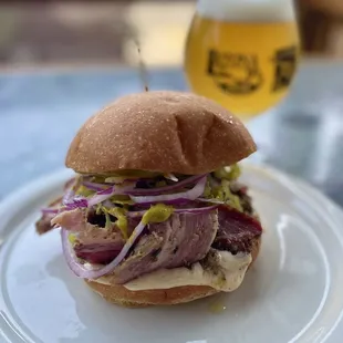 House-made porchetta on brioche with herbed mustard, garlic mayo, red onion and pepperoncini