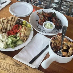 hummus platter, wings, cheesy potatoes