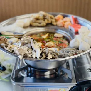 a plate of seafood on a stove