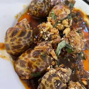 Snails tossed in sweet and sour sauce
