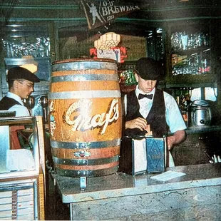 two men behind the counter