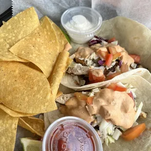 a plate of tacos and chips