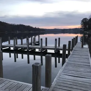 a dock on a lake at dusk