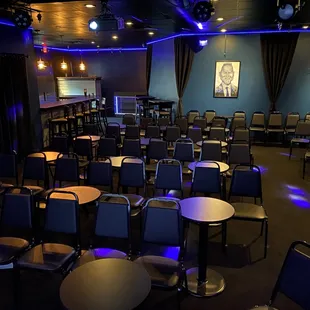 a large room with tables and chairs