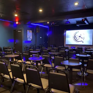 a large screen in the middle of the room