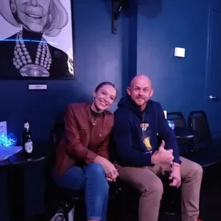 a man and a woman sitting next to each other