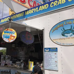 a food truck with signs