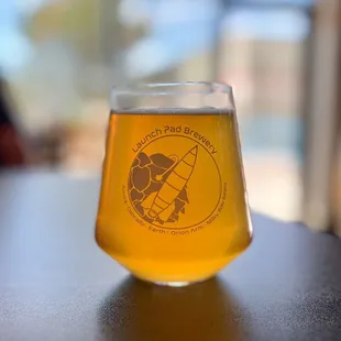 a glass of beer on a table