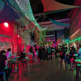 a crowd of people sitting at tables