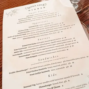 a menu on a wooden table
