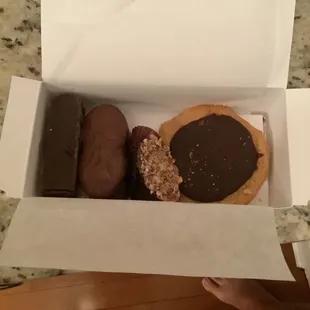 Chocolate/vanilla fudge, chocolate covered nutter butter cookies, a piece of dark chocolate with almonds, and a PB fudge cookie. YUM!
