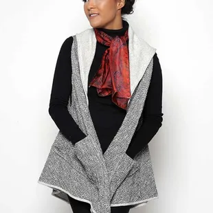 Our sumptuous nubby cotton triangles vest is a dramatic layer. Designed from two triangles sewn together. It's Euclidean!