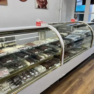 a display case with a variety of pastries