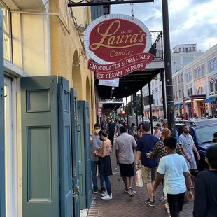 people walking down the sidewalk