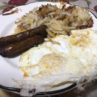 Eggs with sausage and home fries (grits not shown)