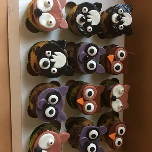 a box of cupcakes decorated like animals