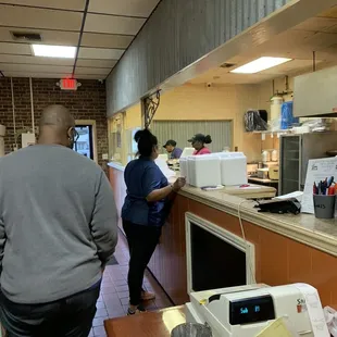 a man and a woman in a kitchen