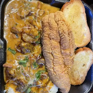 Fried catfish over shrimp and grits