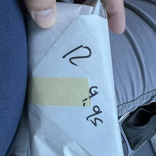 Egg salad sandwiches wrapped in paper waiting to be unwrapped.