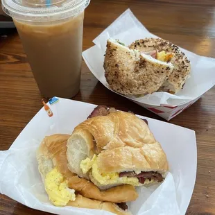 The classic on a croissant with bacon and the frenchie on a bagel