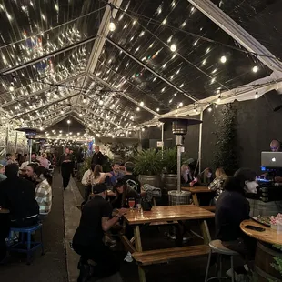 Outdoor seating area is resplendent with lights