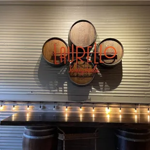a bar with wine barrels