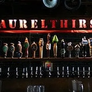 a row of beer taps