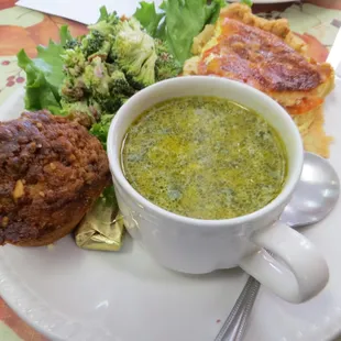 pumpkin struesel, broccoli salad, Savannah quiche with a blends of cheese and onion and tomatoes, and a cup of creamed cilantro