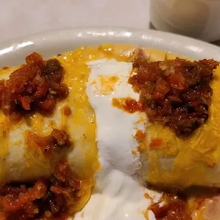 Breakfast burrito with home made mild and hot salsa, and queso. DELICIOUS!!!!!!