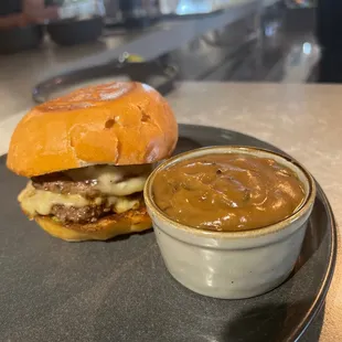 Dry aged burger with fontal cheese. Mushroom gravy on the side for dipping.   Yummy!