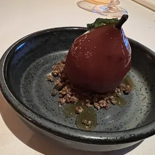 a plate with a pear on it