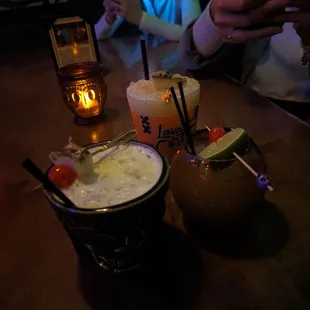 Basic Batch with the pineapple garnish, the Whiskey Sour with lime garnish and the top is the Mai Tai