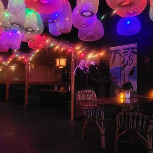 a restaurant decorated with colorful lights