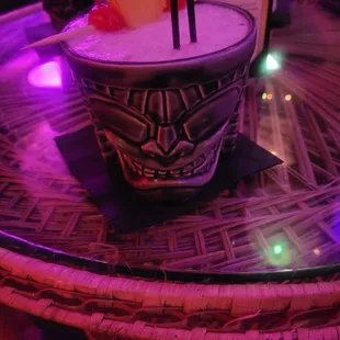 a drink in a glass on a table