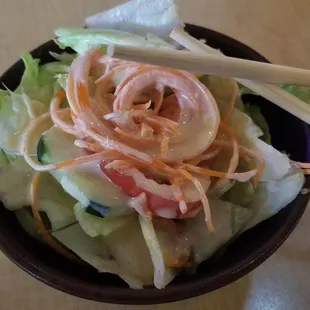 Salad: A simple mix of lettuce, cucumber and tomato, served with a miso-based dressing.