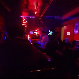 a group of people sitting at a bar
