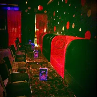 a row of chairs with laptops on them