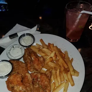 a plate of food with fries and a drink